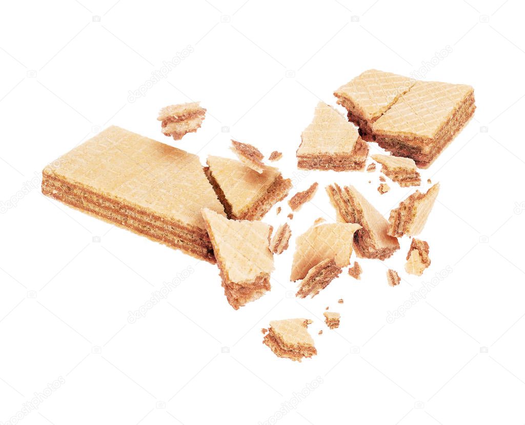 Wafers broken into pieces in the air on a white background