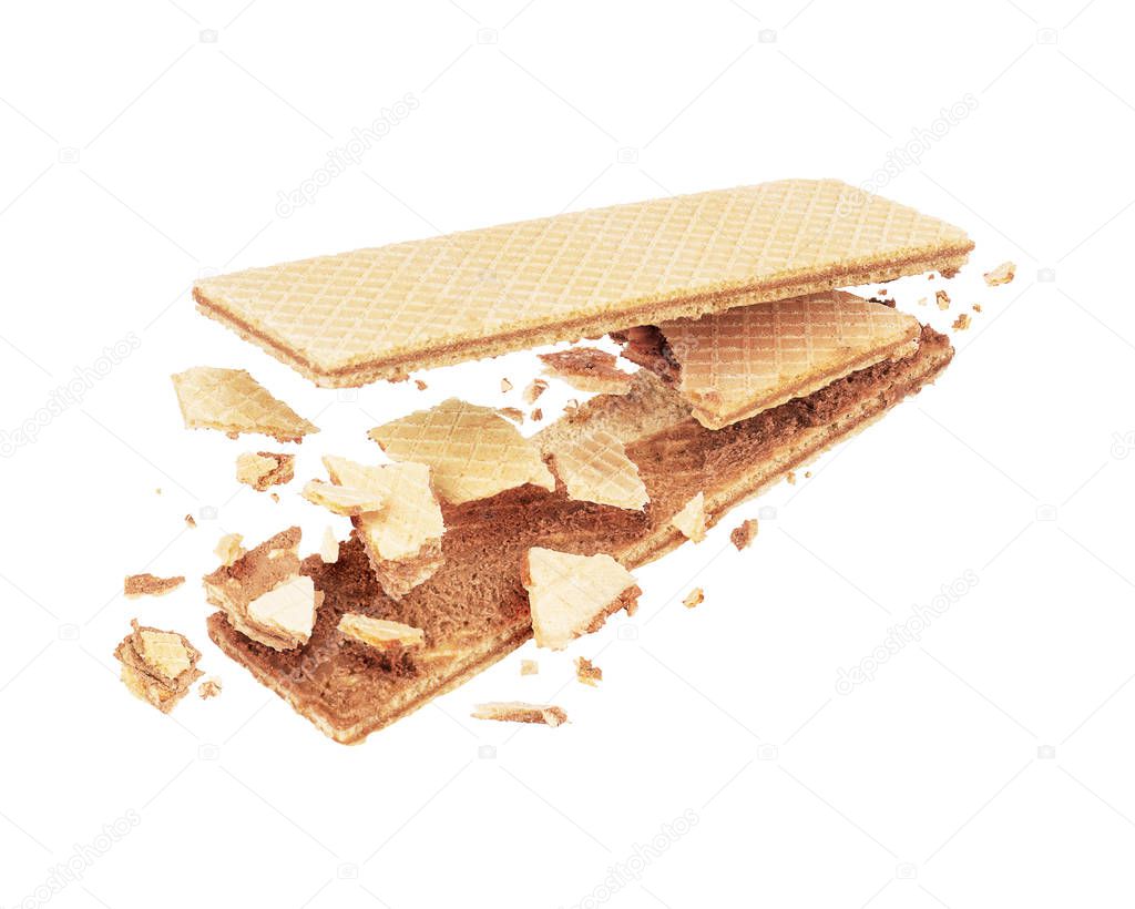 Waffle crushed into pieces in the air on a white background