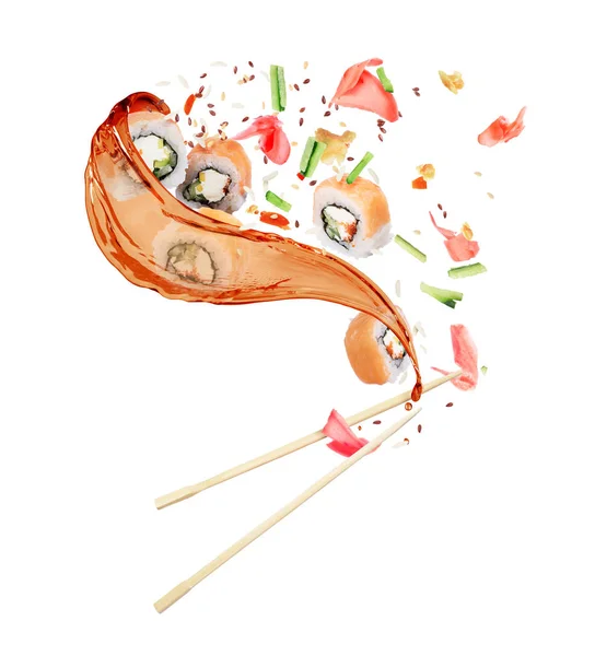 Pieces of sushi with splashes of soy sauce on white background