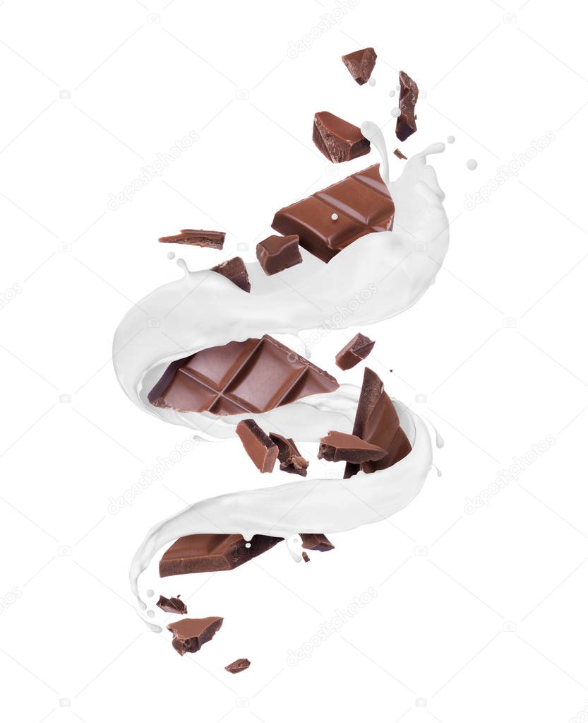 Pieces of chocolate bar with swirling milk splashes on a white background