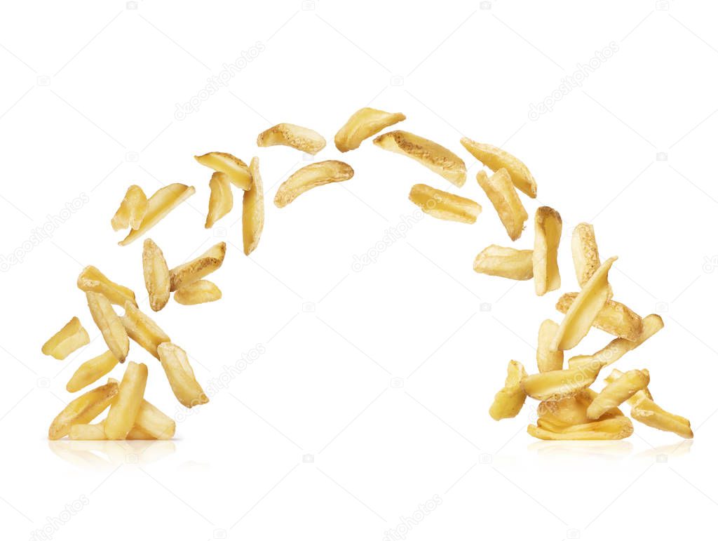 Baked potatoes fall down on a piles, isolated on a white background