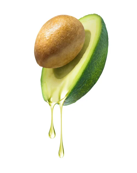 Капли масла капают с авокадо на белом фоне — стоковое фото