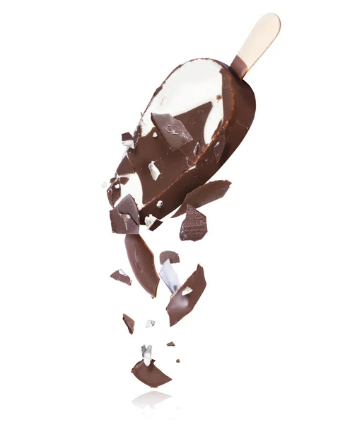 Pieces of chocolate ice cream are falling down, isolated on white background — Stock Photo, Image