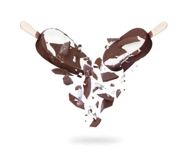 Two chocolate ice creams crushed in the air, isolated on a white background — Stock Photo, Image