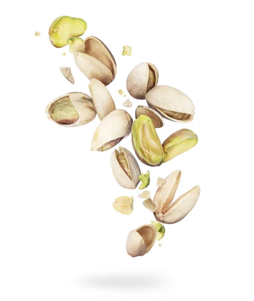 Pistachios crushed in the air close-up on white background — Stock Photo, Image