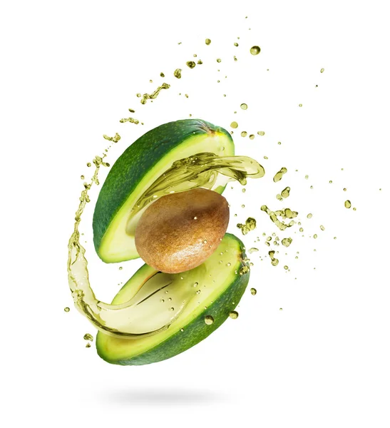 Avocado Affettato Con Spruzzi Succo Primo Piano Isolato Fondo Verde — Foto Stock