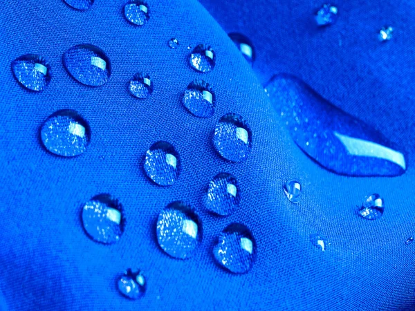 Blauer Wasserdichter Stoff Mit Regentropfen Nahaufnahme — Stockfoto