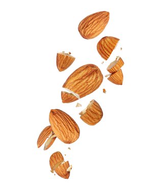 Levitation of whole and crushed almonds in the air isolated on white background