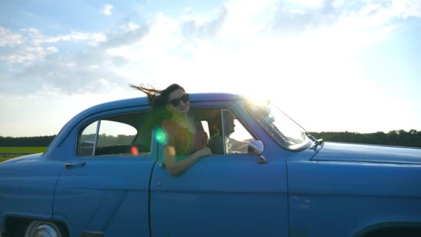 Attractive Girl Sunglasses Leaning Out Vintage Car Window Enjoying Trip — Stock Video