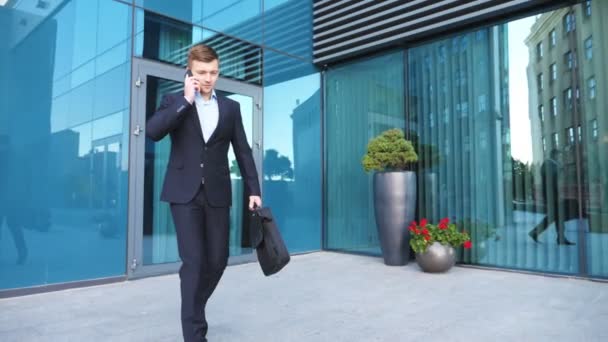 Young Businessman Suit Walking City Street Talking Phone Modern Building — Stock Video