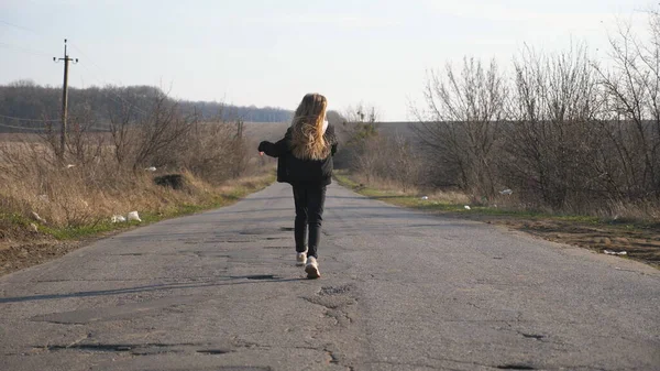 Rear View Little Girl Jacket Walks Empty Road Dancing Funny — Stock Photo, Image