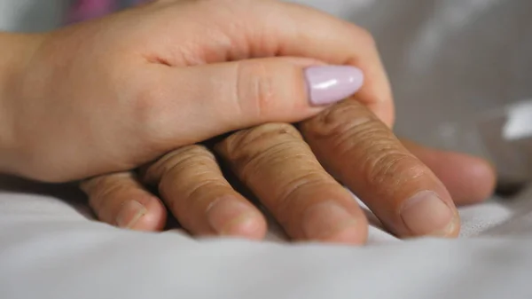 Granddaughter Takes Gently Touches Wrinkled Arm Sick Mature Grandma Lying — Stock Photo, Image