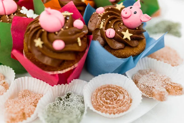 Miss piggy cupcakes - beautiful and delicious cakes decorated with pink cream shaped funny piggy faces, christmas and new year 2019 themed treat for kids party.