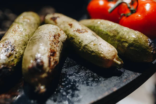 delicious vegetables grilling in open grill, outdoor kitchen. food festival in city. tasty food peppers zucchini roasting on basket, food-court. summer picnic