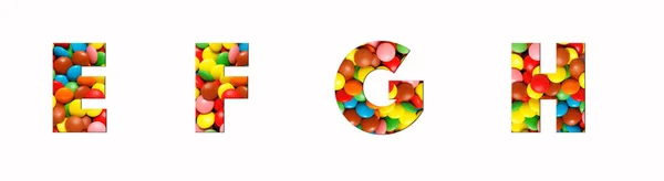 キャンディアルファベットのフォントe 、 f 、 g 、 hは実際の色のキャンディカット文字の形で作られています。コンセプトのアイデアとあなたのユニークな装飾のための鮮やかなキャンディーフォントのコレクション — ストック写真