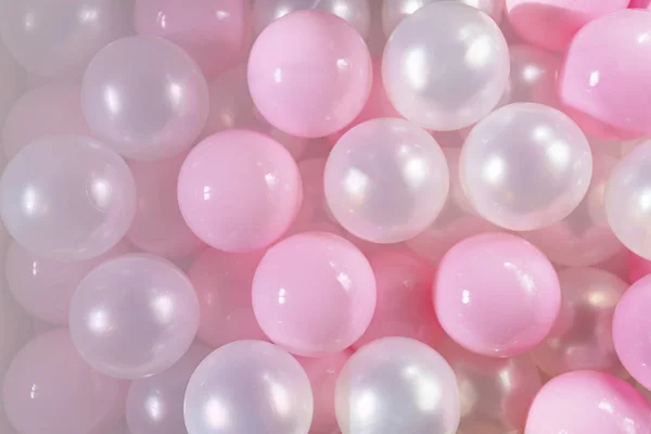 Pink and white balls, pastel pink bubbles for beautiful birthday texture. Flat lay, top view