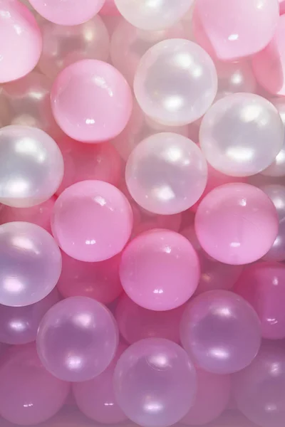 Pink and white balls, pastel pink bubbles for beautiful birthday texture. Flat lay, top view