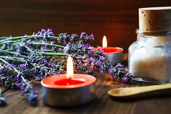 Spa massage setting with lavender flowers, scented aroma candles — Stock Photo, Image