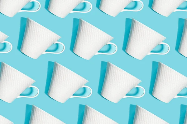 Coffee pattern of white cup for coffee on blue background.