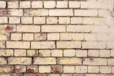 Dökülen alçı ve desenli eski, eski, kirli tuğla duvarın arka planı