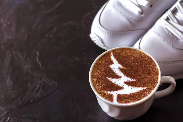 a cup of cappuccino coffee in a ceramic cup on the table