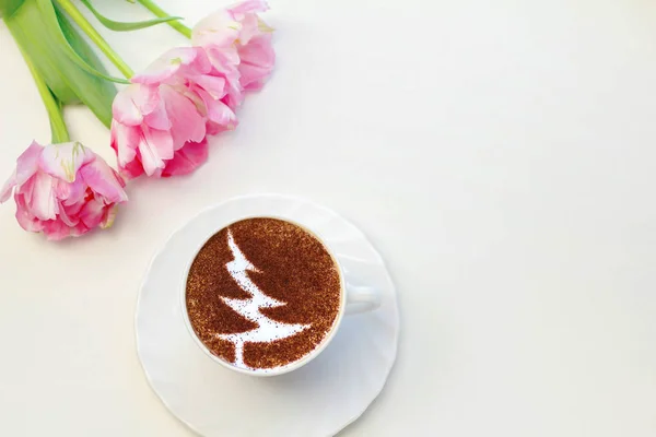 a cup of cappuccino coffee in a ceramic cup on the table