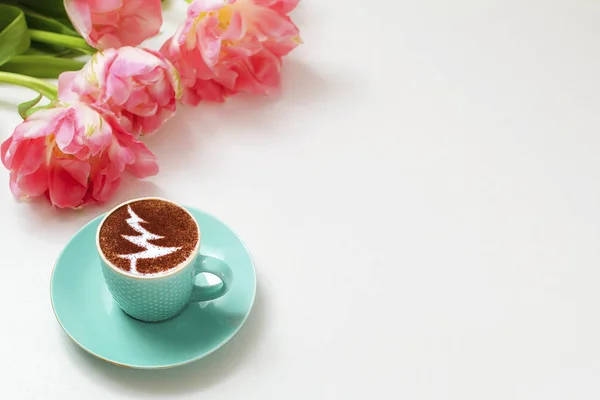 a cup of cappuccino coffee in a ceramic cup on the table