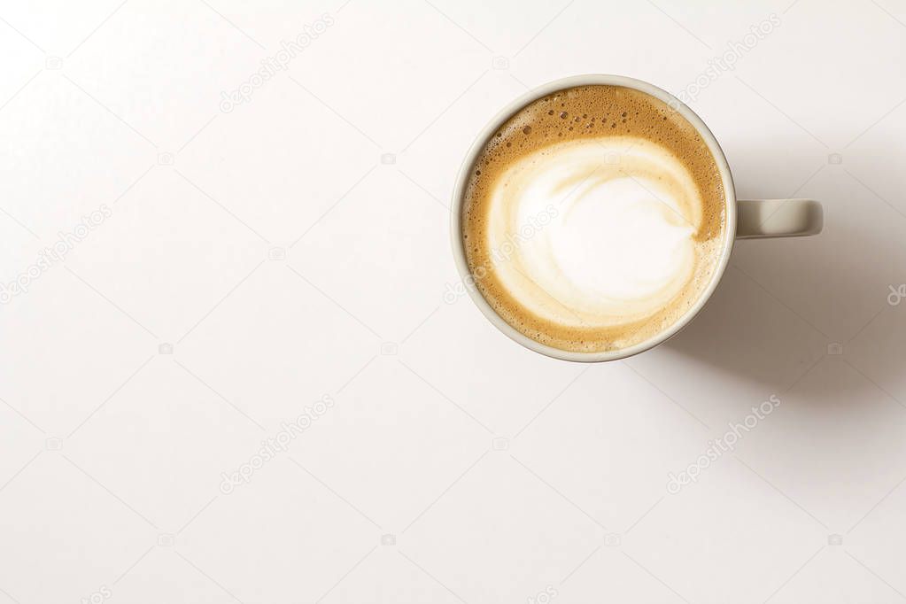 Top view of hot coffee latte cappucino cup with saucer isolated on white background, clipping path included.