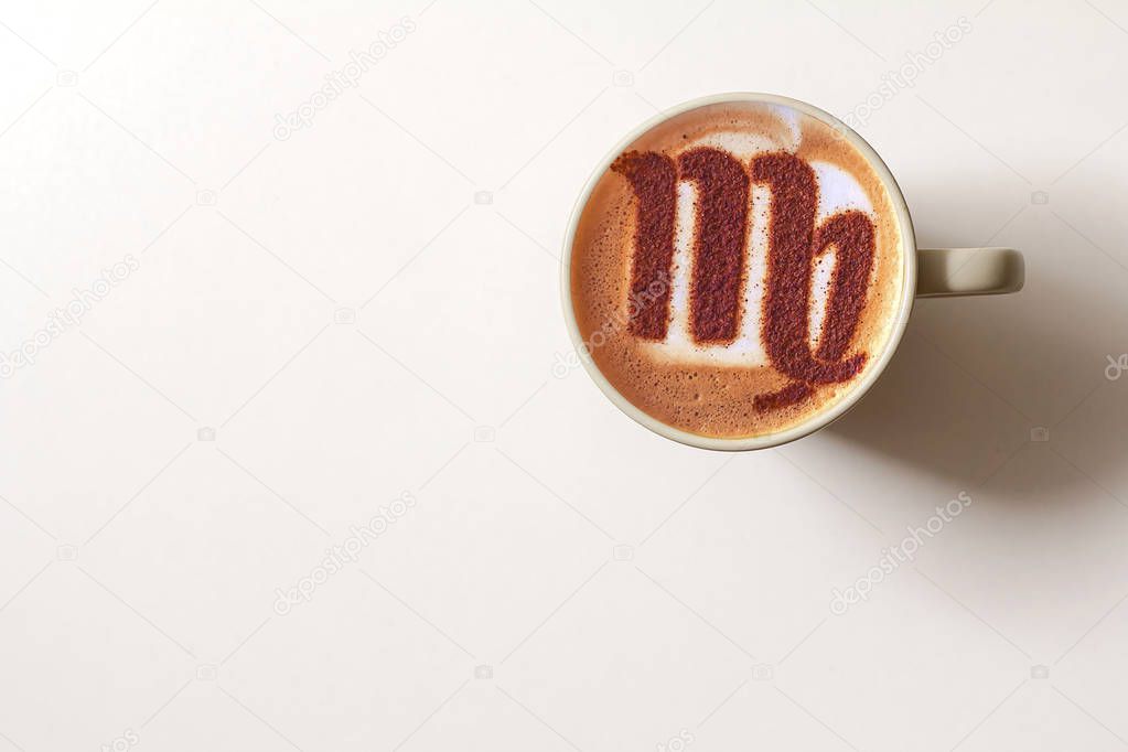 A cup of cappuccino coffee with a zodiac sign Virgo symbol