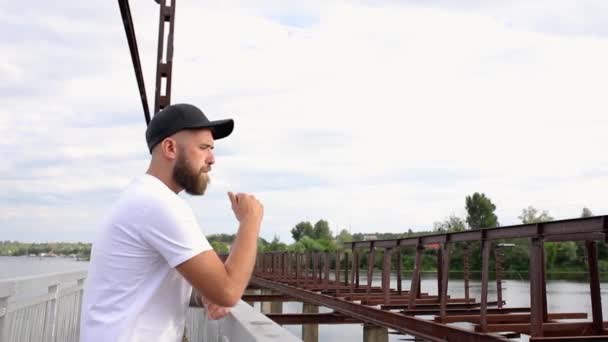 Pensive Young Man Bridge — Stock video