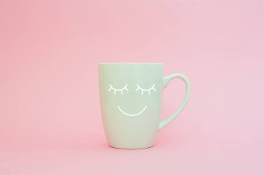 Happy friday word. Cup of coffee on pink background with smile face on mug. Concept about love and relationship. Creative colorful greeting card. clipart