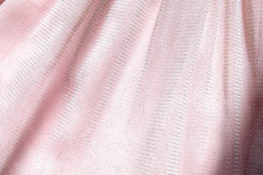 Güzel narin pembe arka plan. Parlak kafes kabarık kumaş yakın çekim doku