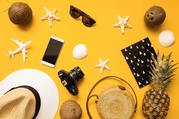 Summer traveler accessories. Straw hat,  camera