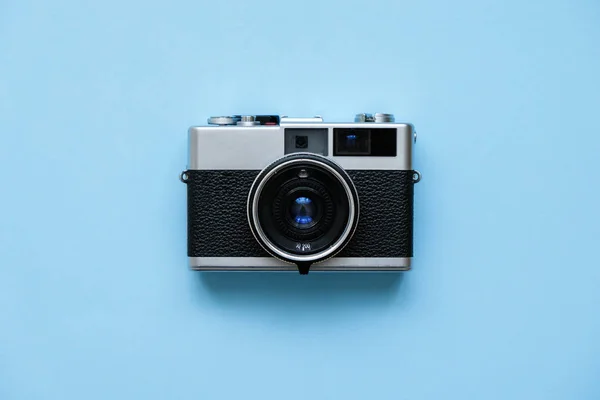 Fashion Film Camera on blue background.  Photo shooting. Pop Art. Hipster Trendy Vintage Accessories. Minimal flat lay