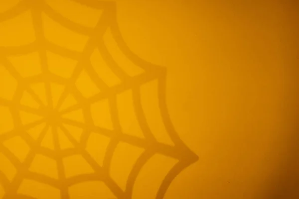 Sfondo arancione Halloween con ragnatela nera — Foto Stock