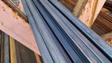 Rectangular steel profile pipes in a metal warehouse, selective focus. Building materials. Close-up of rectangular metal profile pipes stacked together. Building materials warehouse