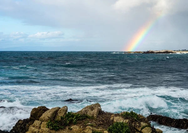 Rainbow over ocean  near Pebble Beach, Monterey, California,, USA, on the 17-mile drive route in the winter of 2018