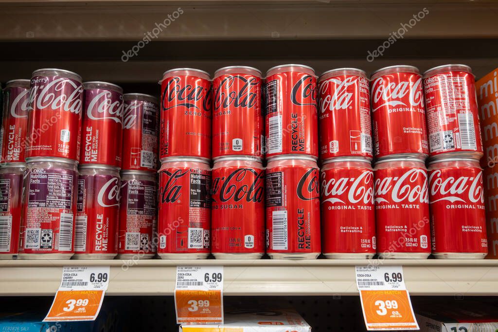 Davis, CA, USA. 22 August 2025. Supermarket store shelf with  Coca Cola red cans