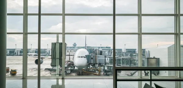 Plane parked at the gate on background