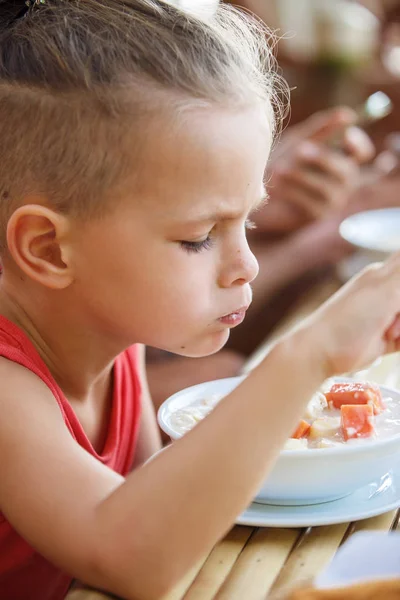 Baby boy is eating poridge in Thailand — Stock Photo, Image