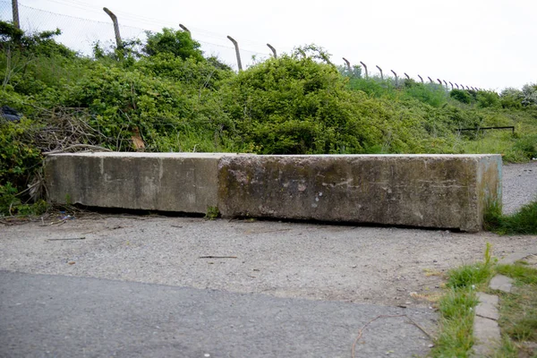Concrete barrier at the entrance to a closed car park