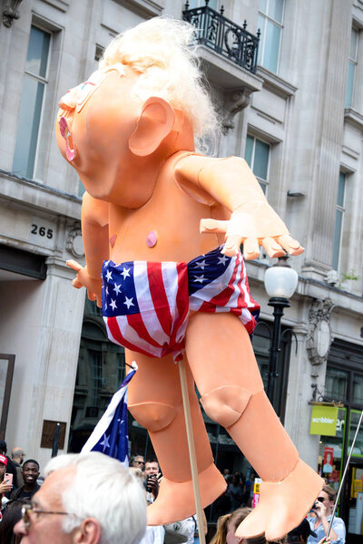 London, United Kingdom, 13th July 2018:Placards carried by anti Donald Trump protesters marching in central London