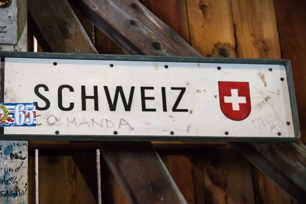 The international border post on the old wooden brdge across the river Rhine between Liechtenstein and Swizterland