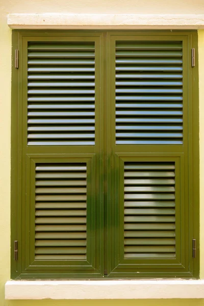 Shuttered windows in Gibraltar. Gibraltar is a British Overseas Territory located on the southern tip of Spain.
