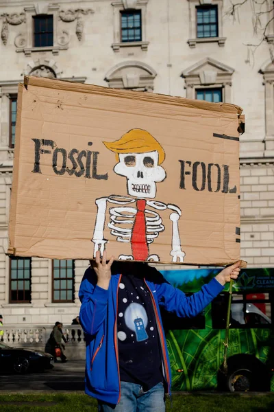 stock image London, UK, United Kingdom 15th February 2019:- Striking school aged children in central London over climate change holding a placard