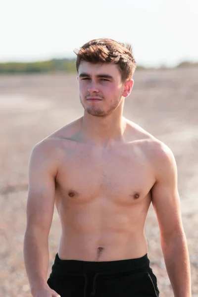 Shirtless on a beach — Stock Photo, Image