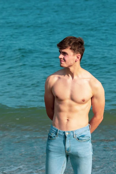 Shirtless on a beach — Stock Photo, Image