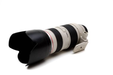 London, United Kingdom, 21st September 2020:- A canon 70-200mm f2.8 USM L Lens with lens hood isolated on a white background clipart