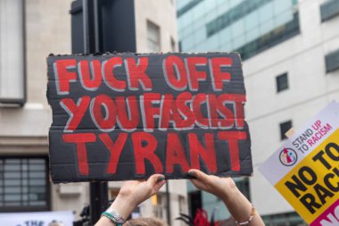 London, United Kingdom, September 17th 2025: The Stop Trump Coalition March in Central London. A Protester holds a sign Reading Fuck Off You Fascist Tyrant