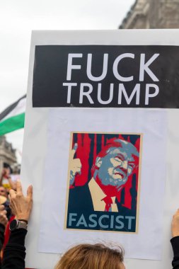 London, United Kingdom, September 17th 2025: The Stop Trump Coalition March in Central London. A Protester holds a sign reading fuck trump fascist